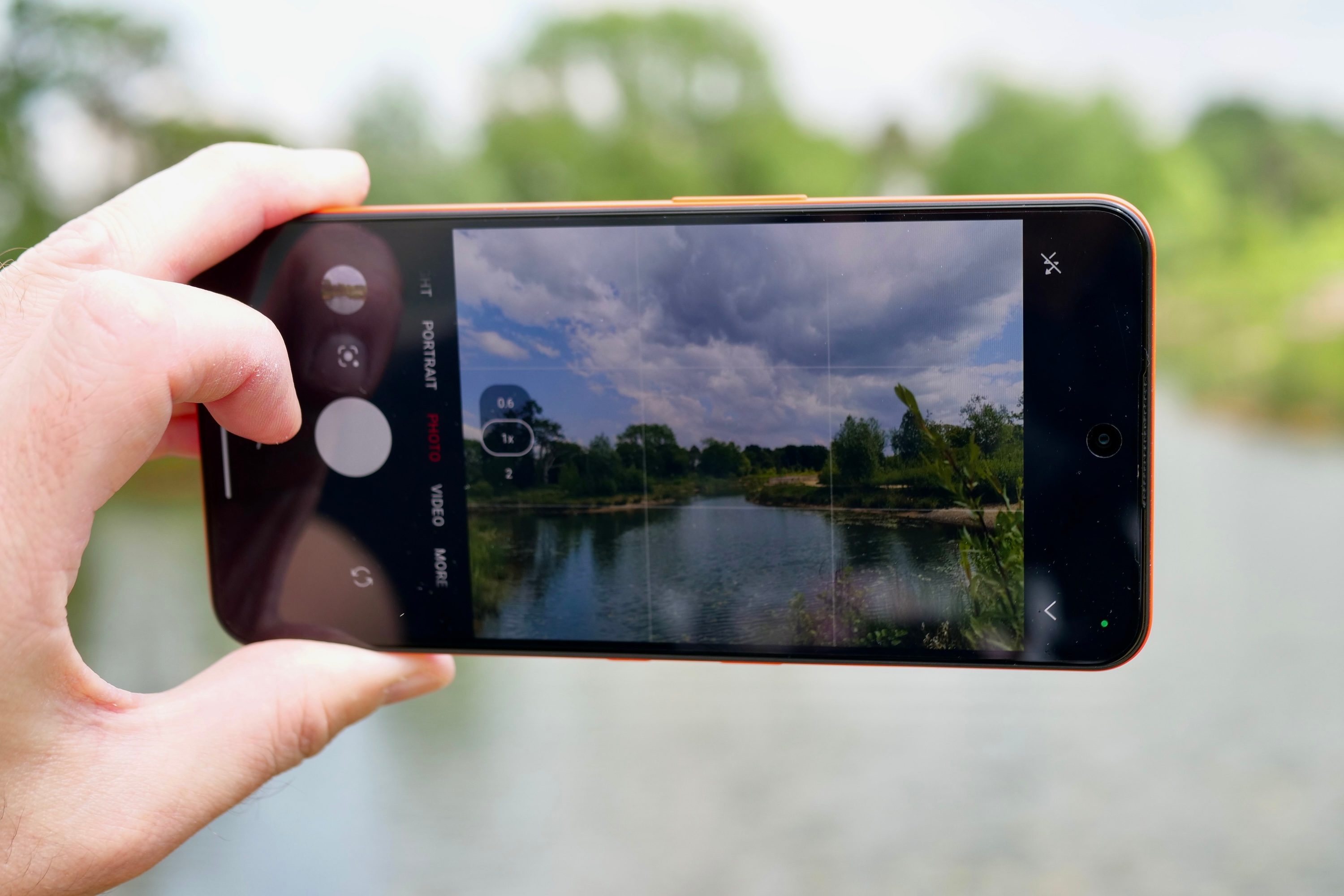 A person taking a photo with the CMF Phone 2 Pro.