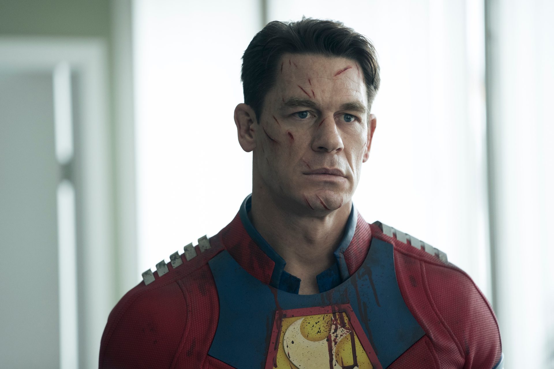 John Cena stares in his Peacemaker costume.