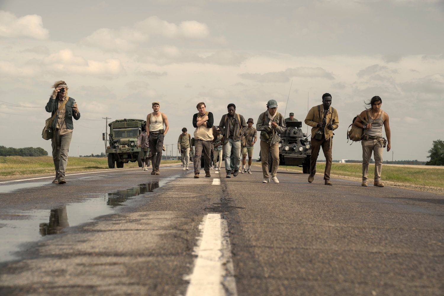A group of boys walk down a road in The Long Walk.