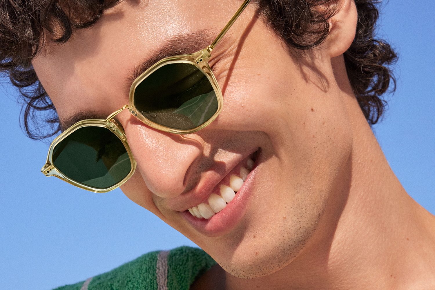 A promotional image showing Warby Parker sunglasses.