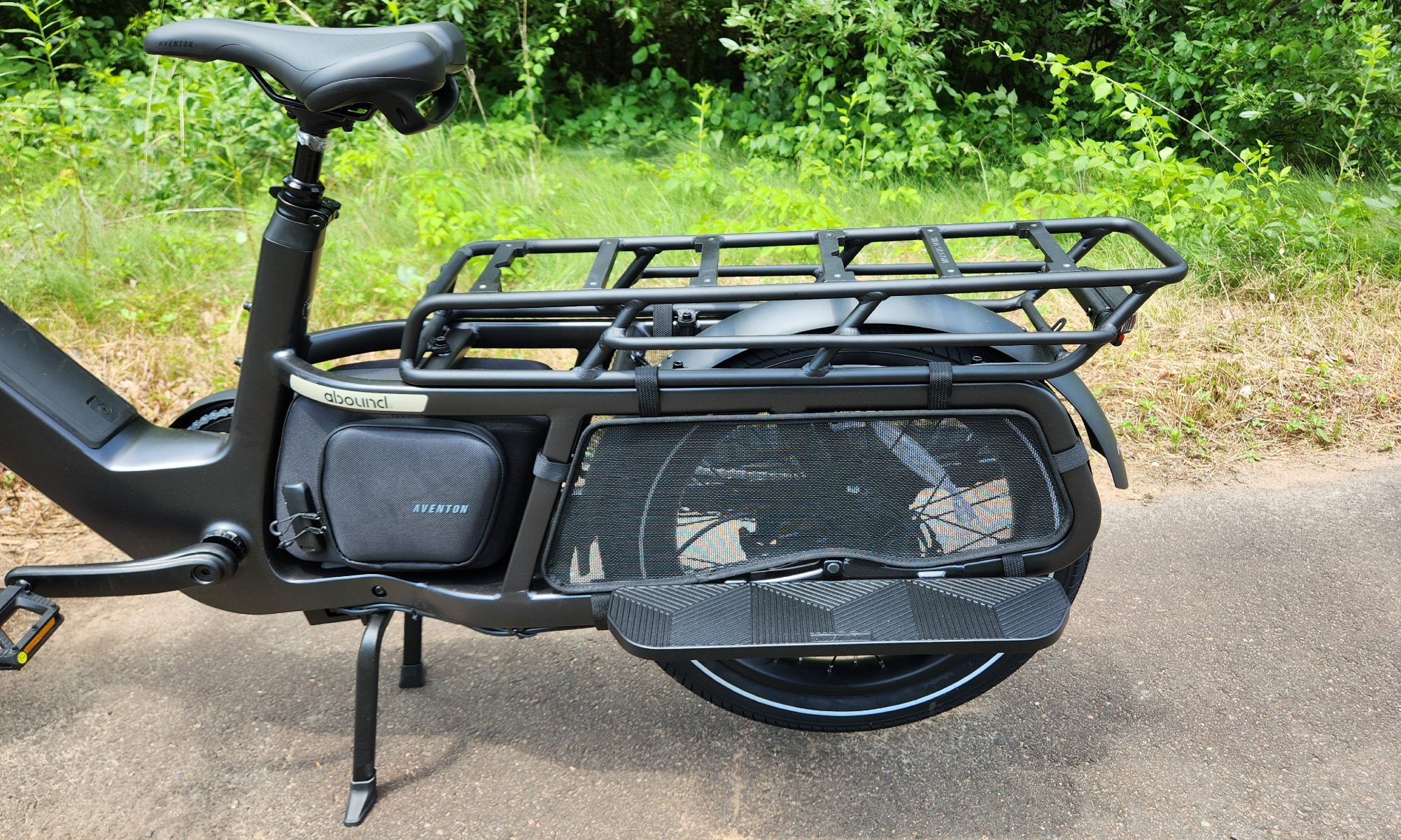 Key features of the Abound LR include the rear rack, wheel guards, foot rails, and lockable storage.