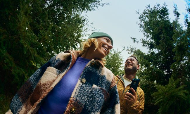 Two people hiking in the woods.