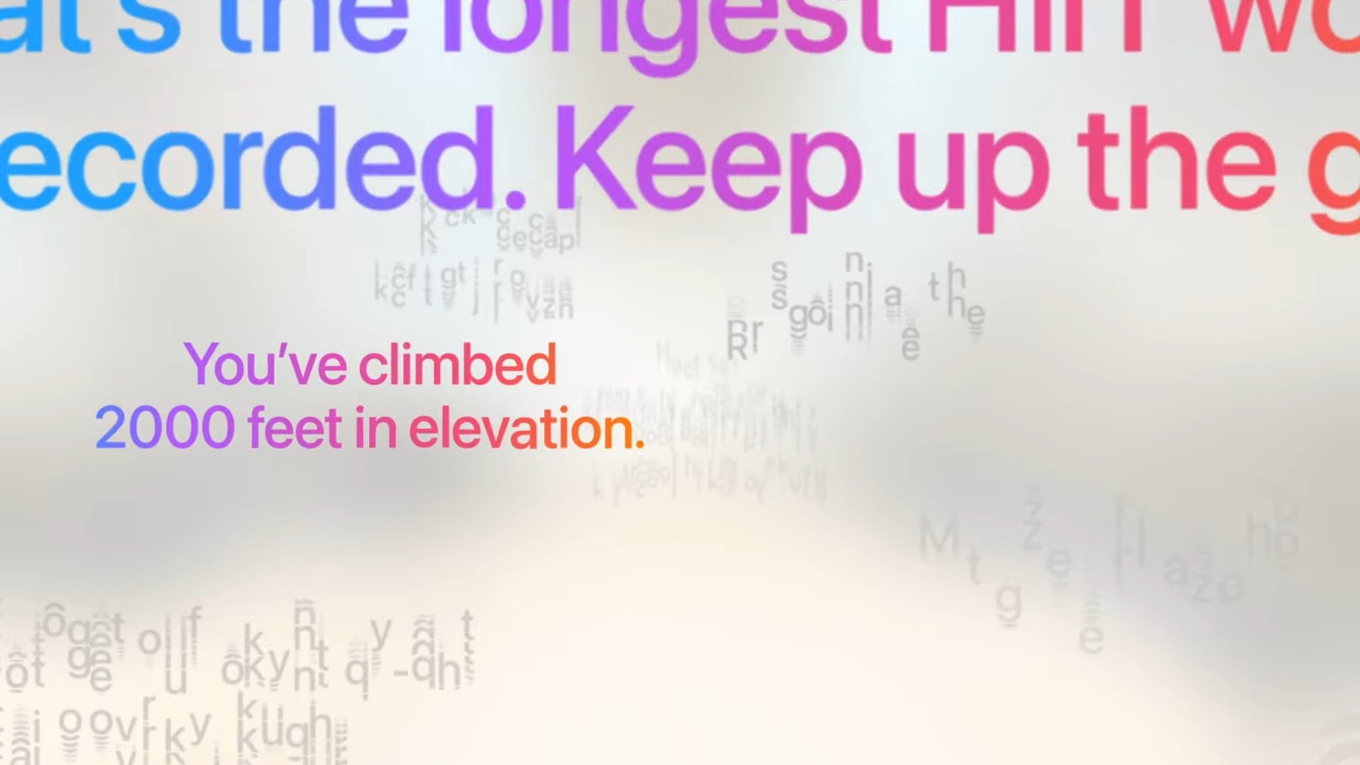 WWDC 2025 keynote screenshot showing Workout Buddy motivational phrases in WatchOS 26