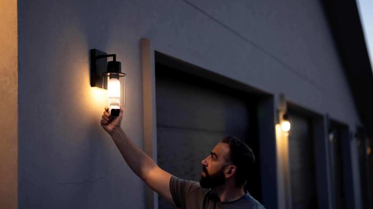 A person installing Wyze Bulb Cam.