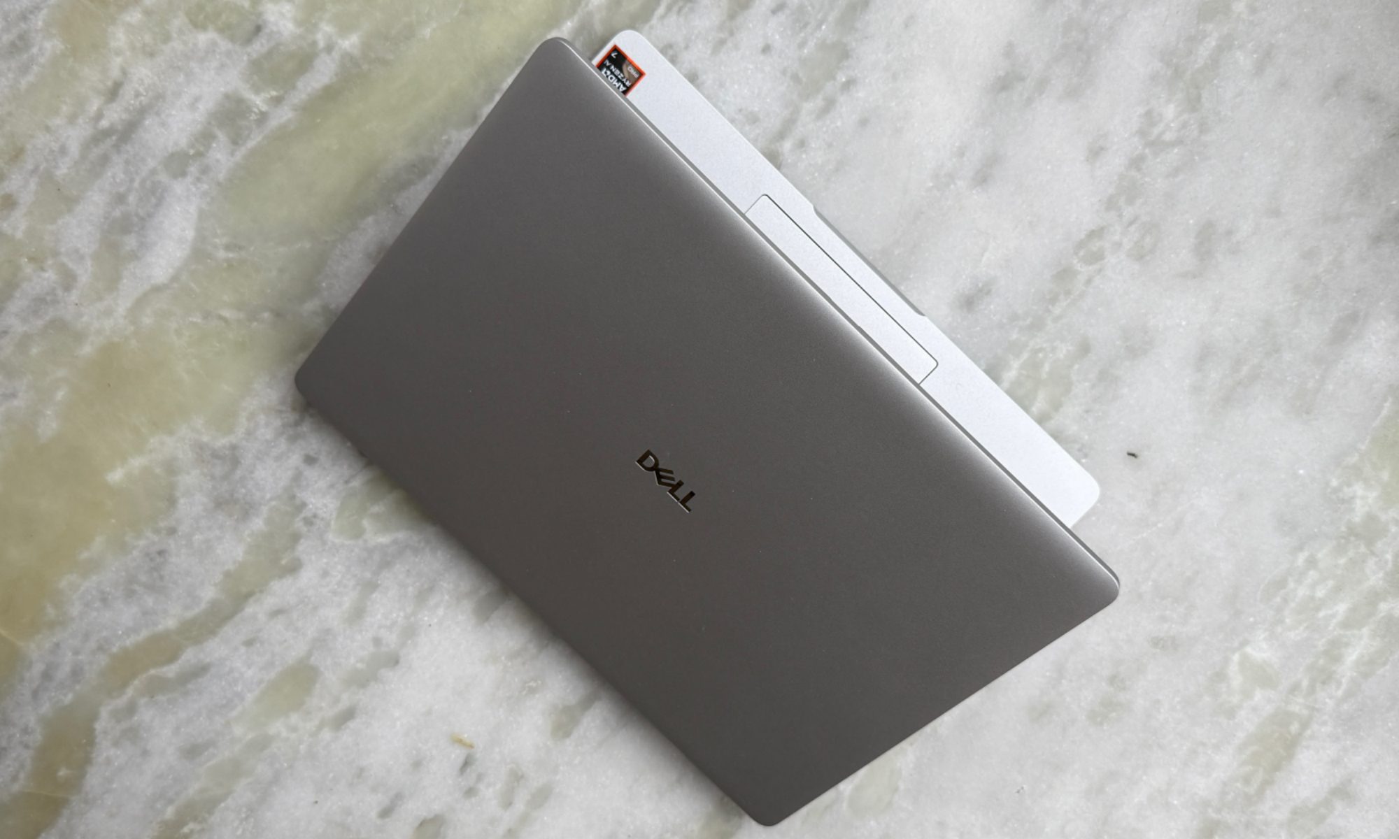 Top angled view of lid on Dell Pro 14 laptop.