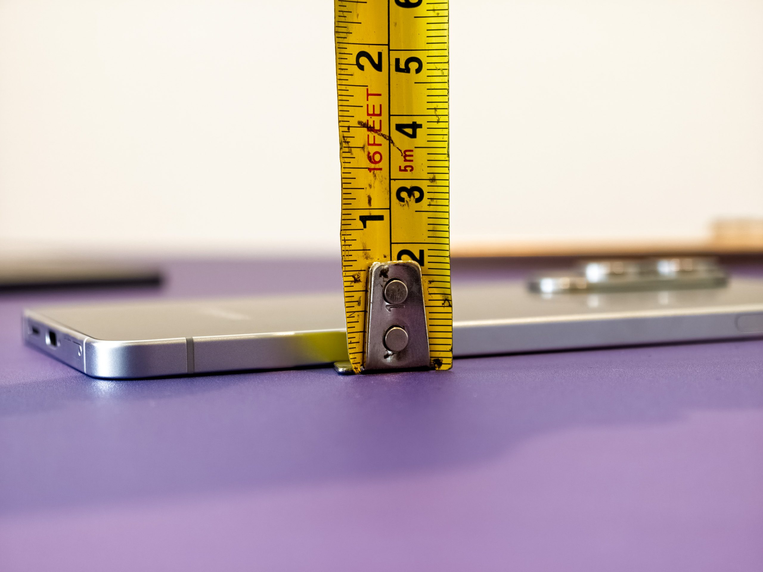Measuring tape showing how thick the Galaxy S25 Edge is