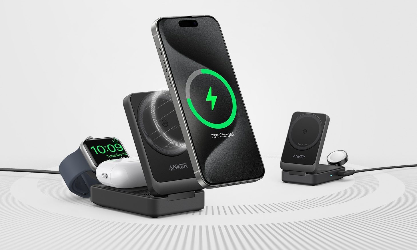 An Anker MagGo charging 3 devices beside an empty Anker MagGo.
