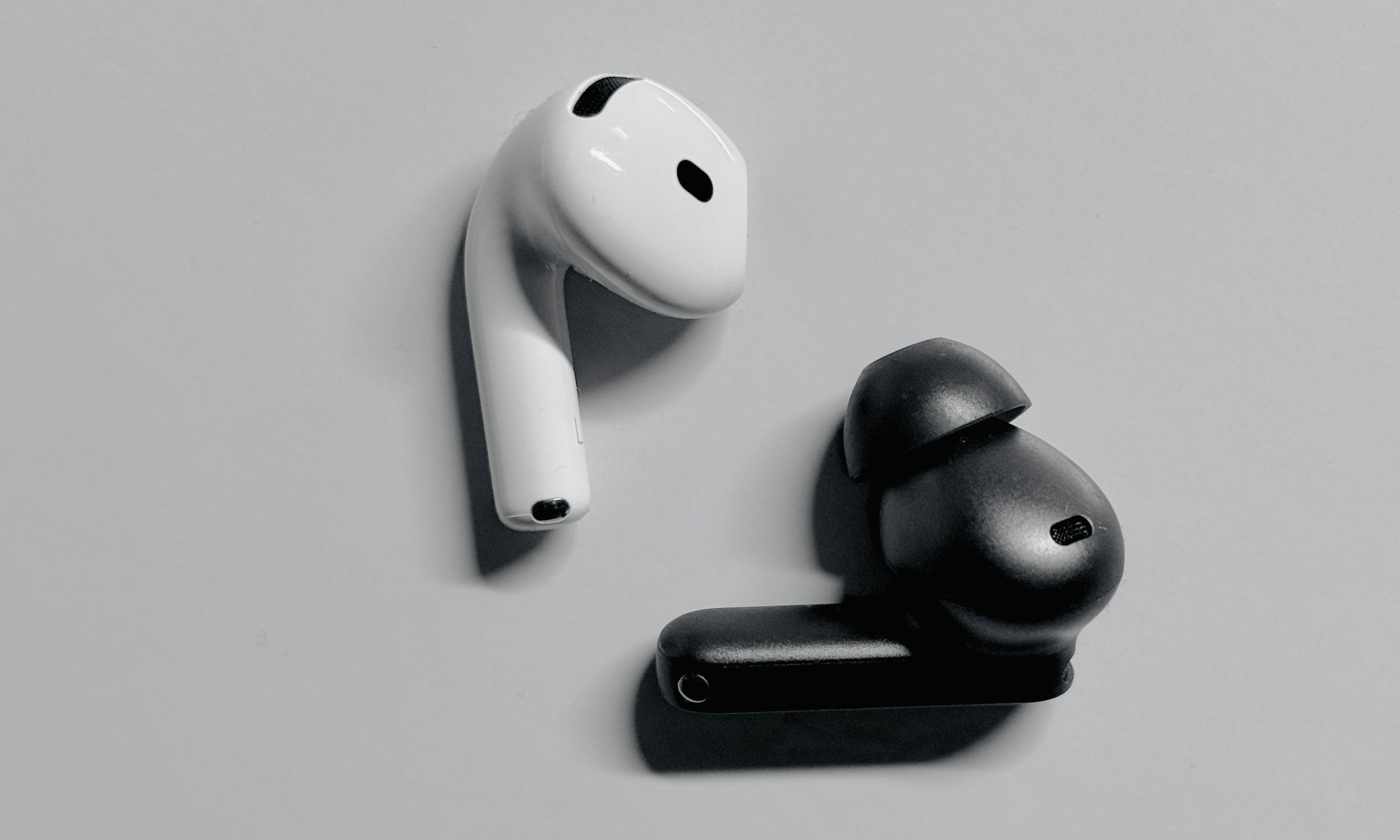 AirPods 4 and OnePlus Buds 4.