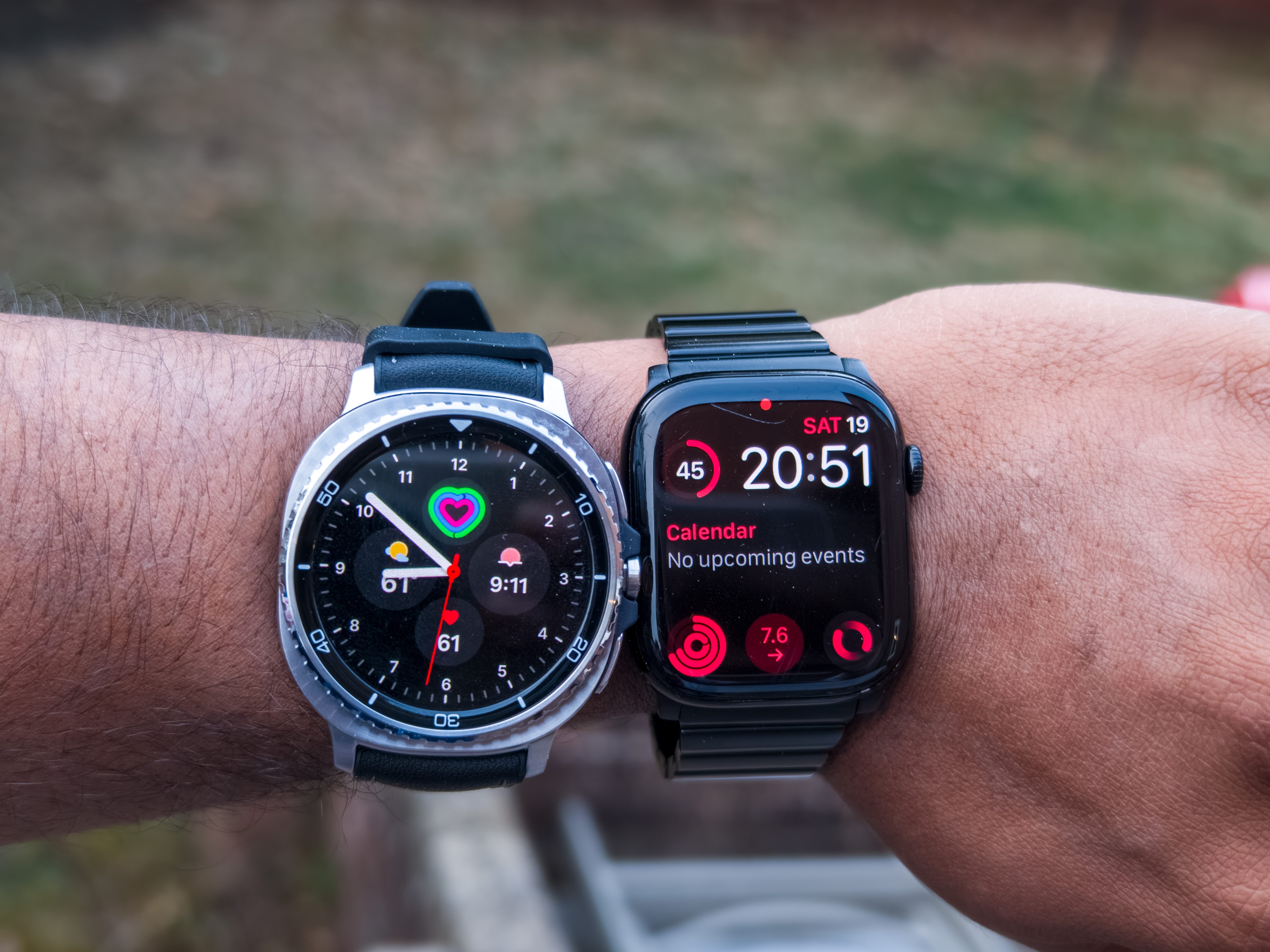 Galaxy Watch 8 Classic in Black on a wrist next to the Apple Watch Series 10 in Black