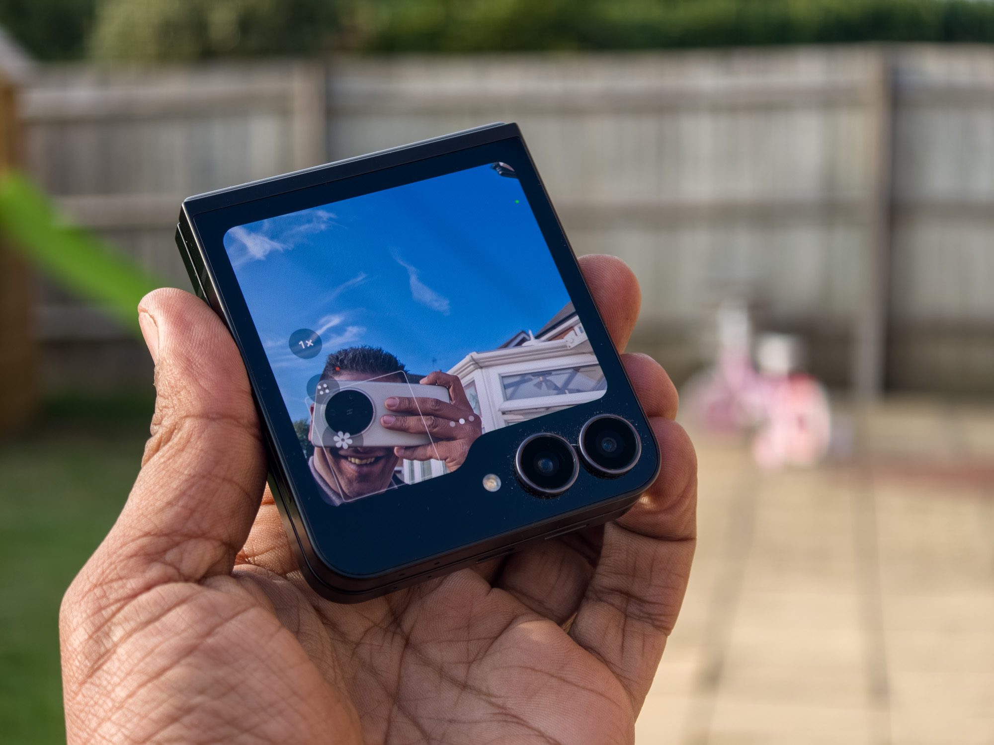 Galaxy Z Flip 7 FE in selfie camera mode using the front screen and main cameras