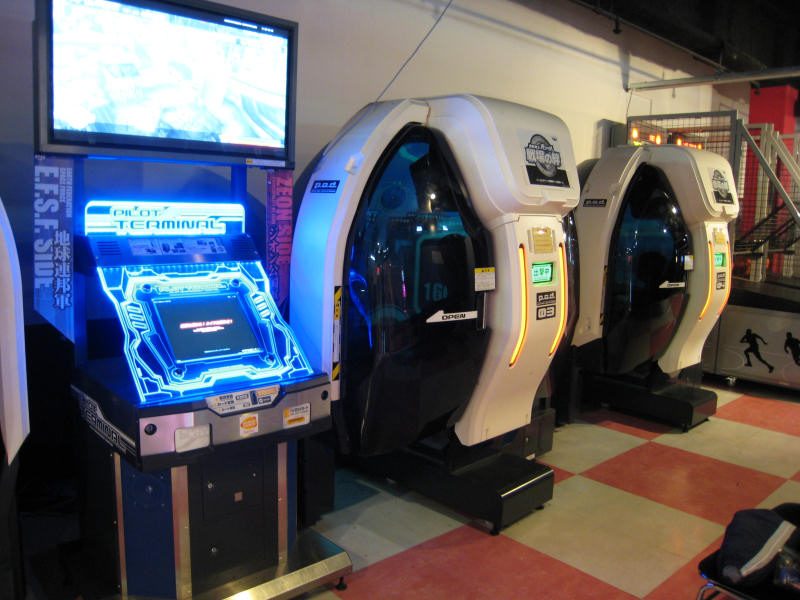 Gundam Kizuna pods in an arcade.
