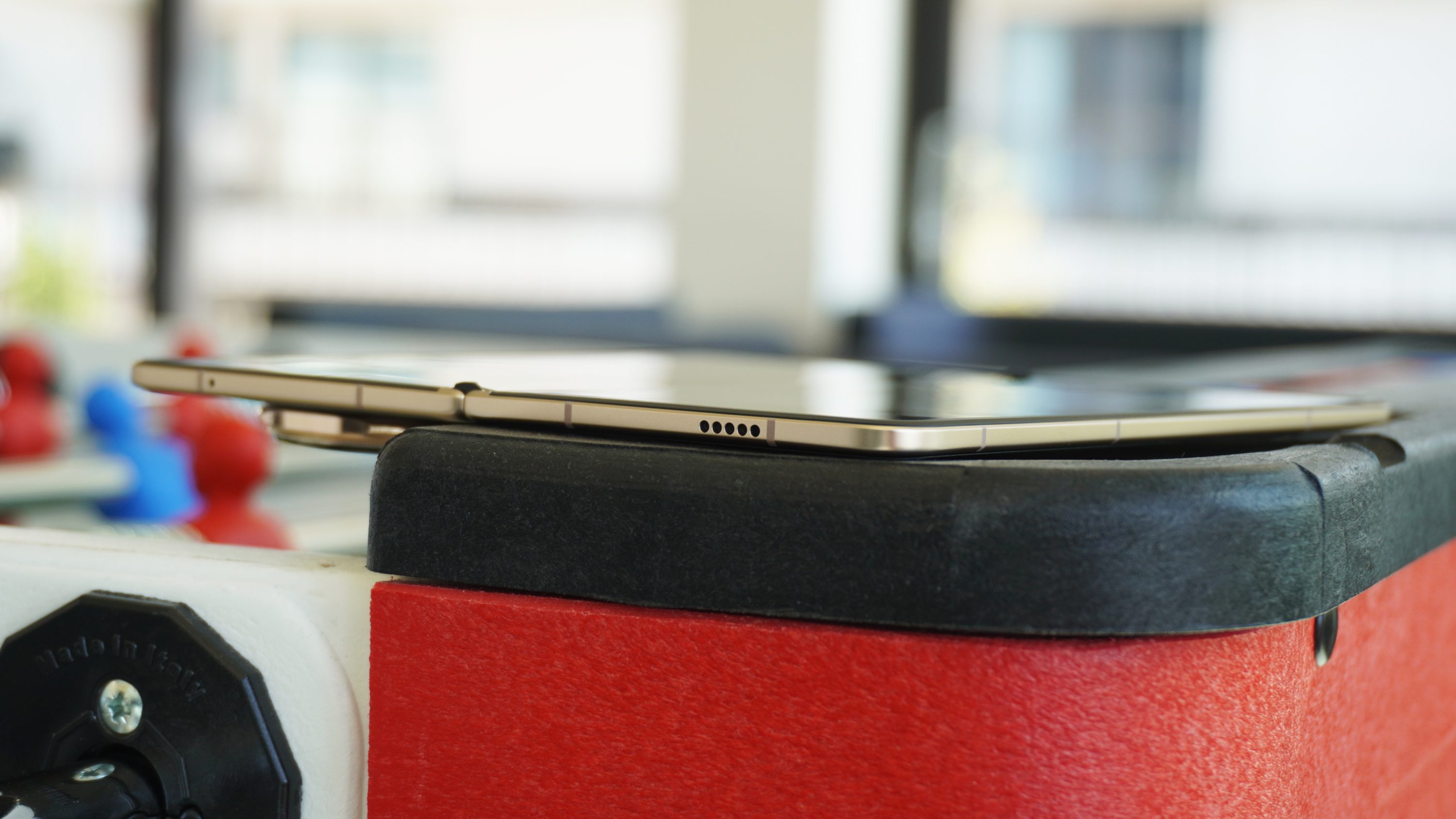 The side profile of the Magic V5 lying on the edge of a foosball table