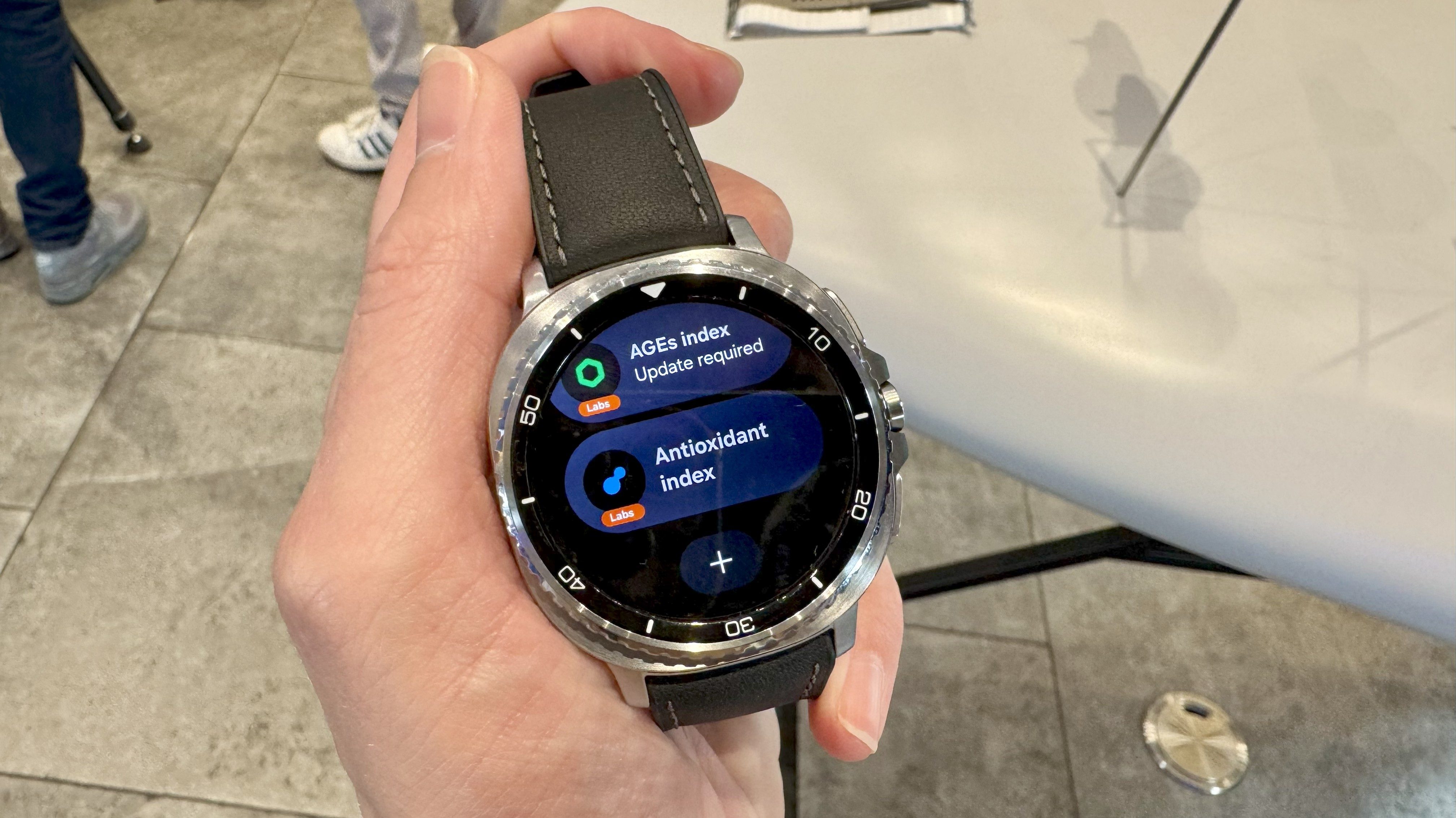 Samsung Galaxy Watch 8 Classic in the hand displaying the antioxidant menu