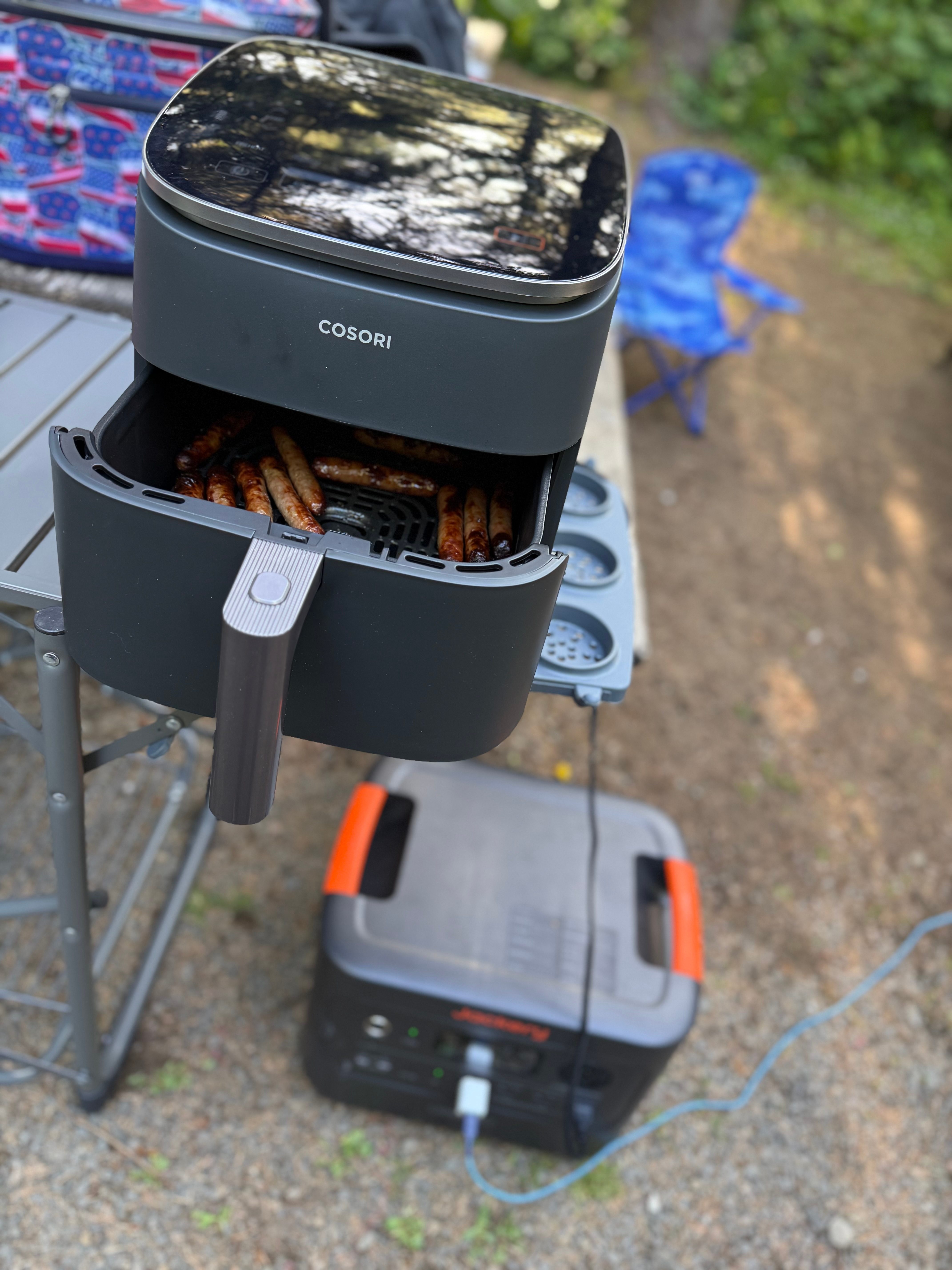 An air fryer plugged into a Jackery HomePower 3000 power station