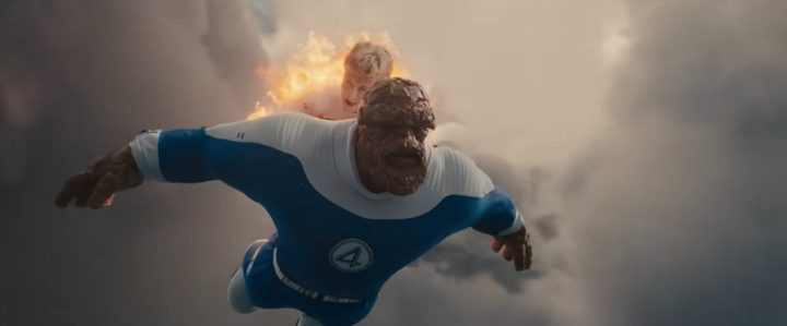 Joseph Quinn as Johnny Storm flying while carrying the Thing in Marvel superhero film, The Fantastic Four: First Steps.
