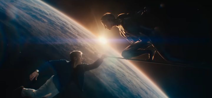 Joseph Quinn as Johnny Storm holding the Silver Surfer's board in the superhero film, The Fantastic Four: First Steps.