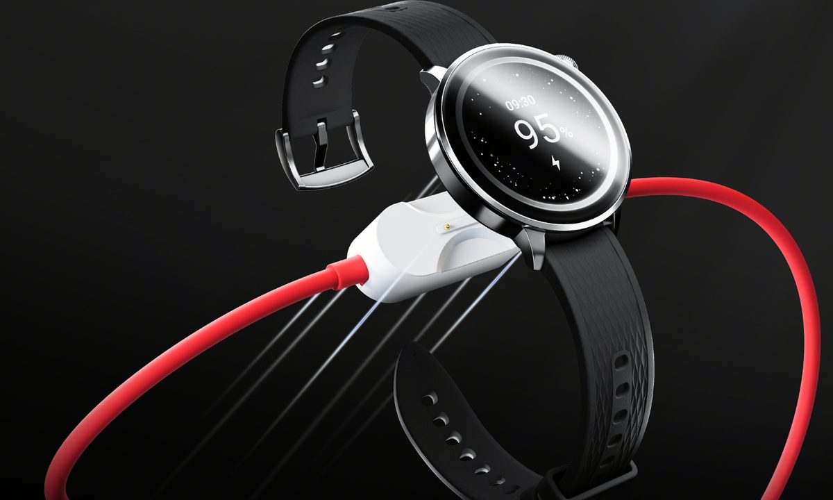 A OnePlus smartwatch being connected to the POGO pin on the OnePlus 2-in-1 charging cable