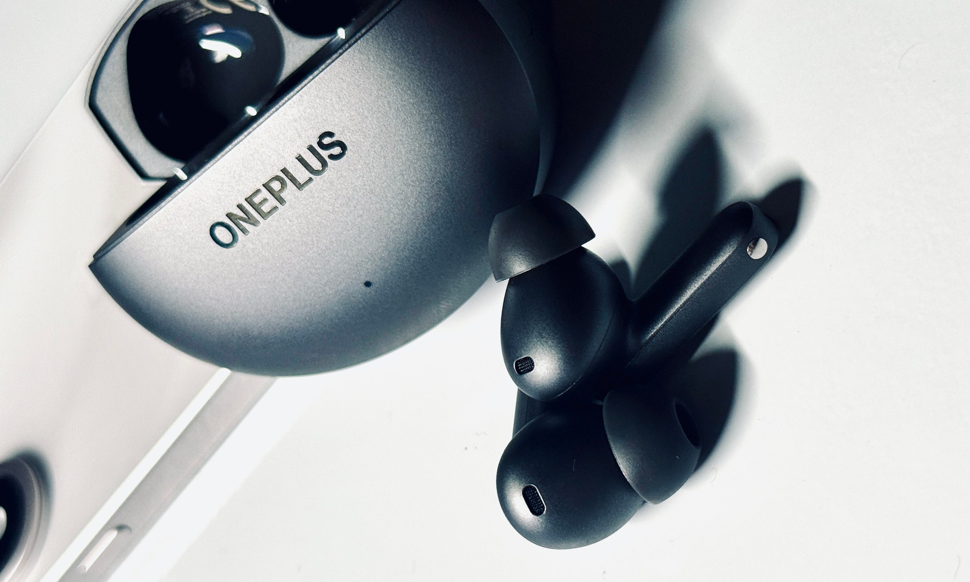 OnePlus Buds 4 earbuds and case.