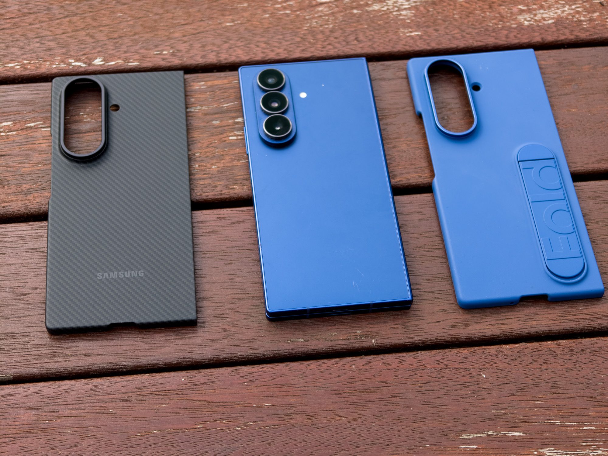 Official carbon shield and silicon case and the Galaxy Z Fold 7 in Blue Shadow on a table