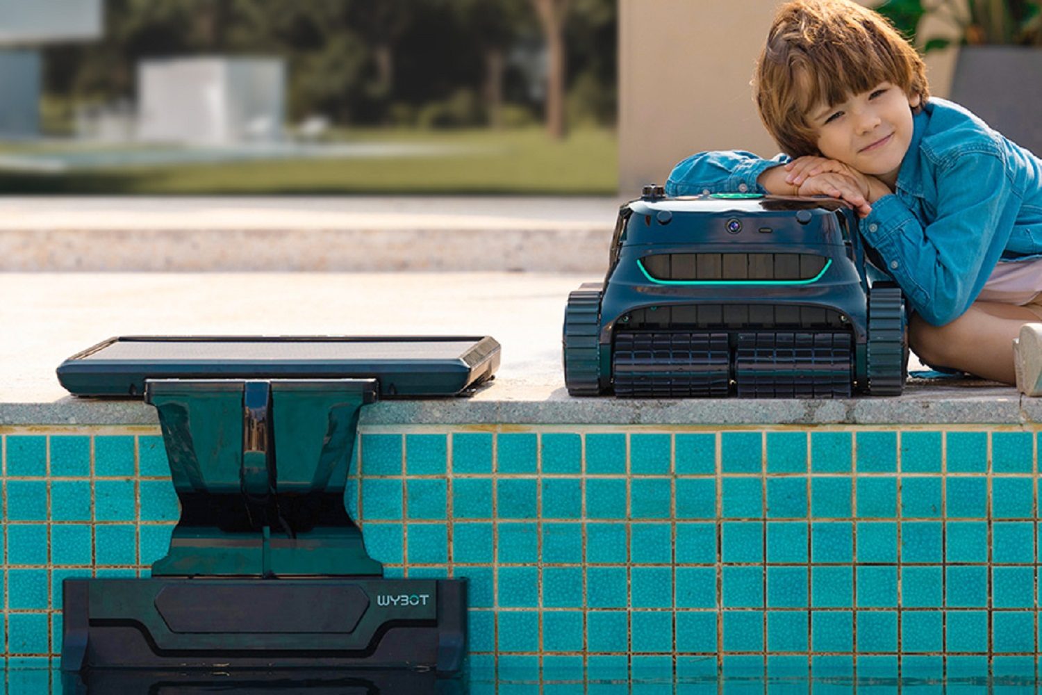 The Wybot S2 Solar Vision robotic pool cleaner beside the swimming pool.