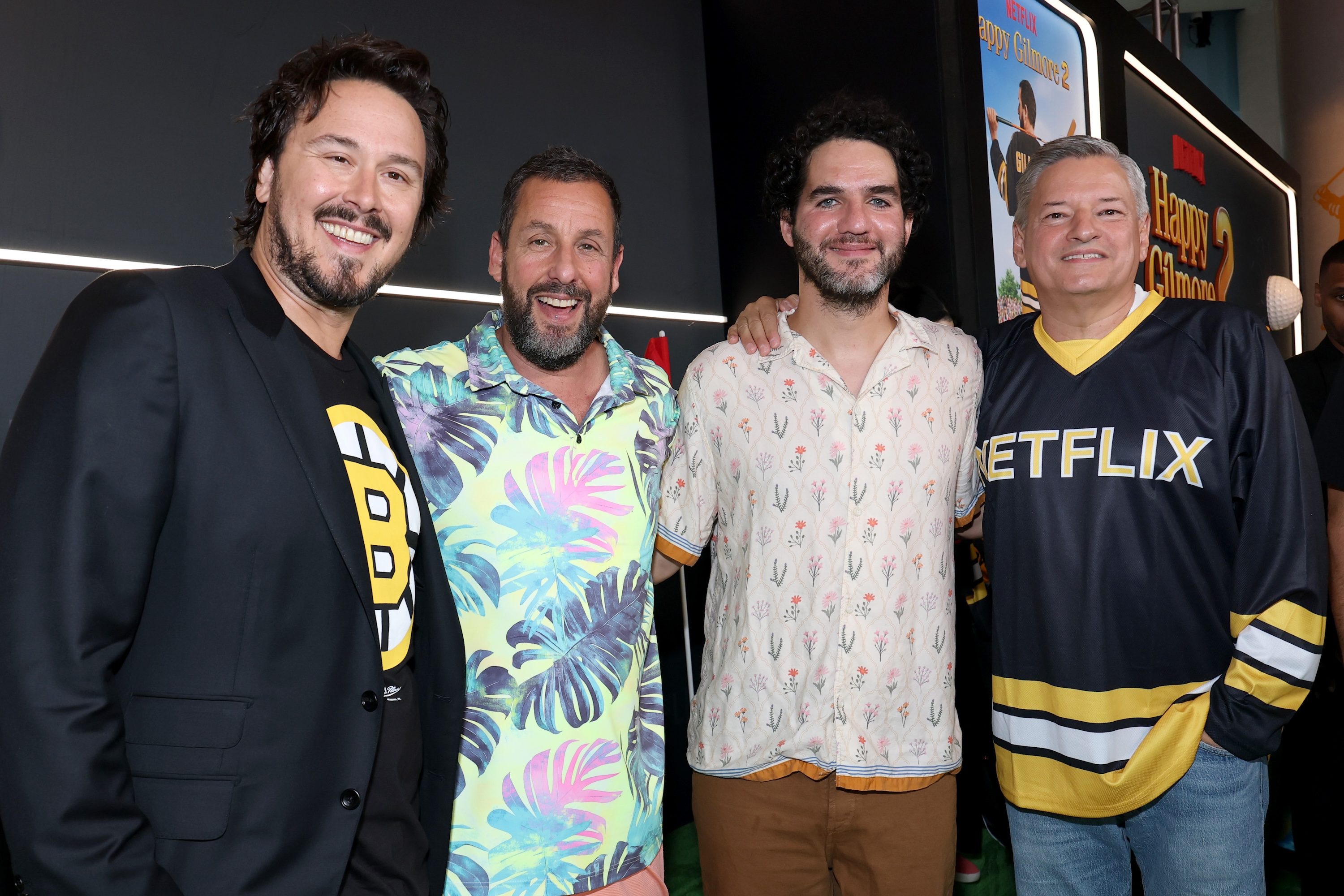 A group of men pose for a photo.