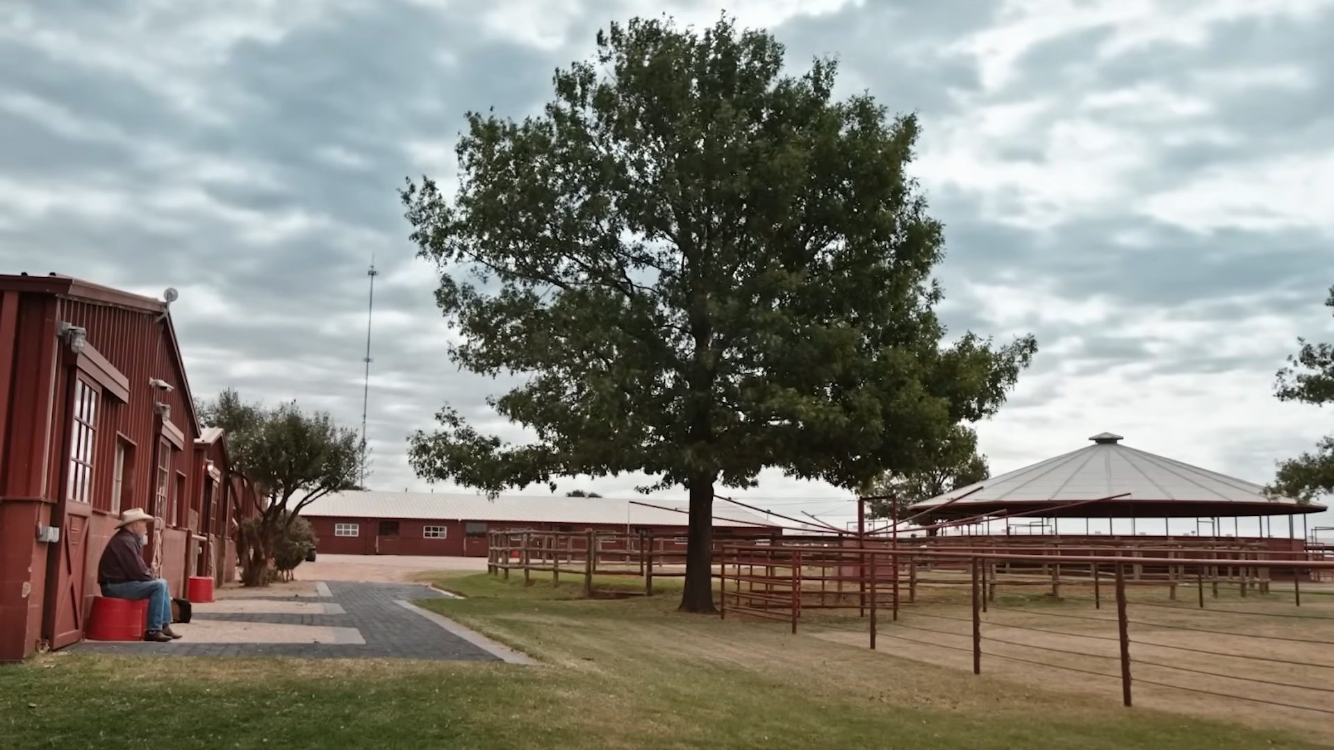 A man sitting down at the 6666 ranch in Yellowstone season 4.