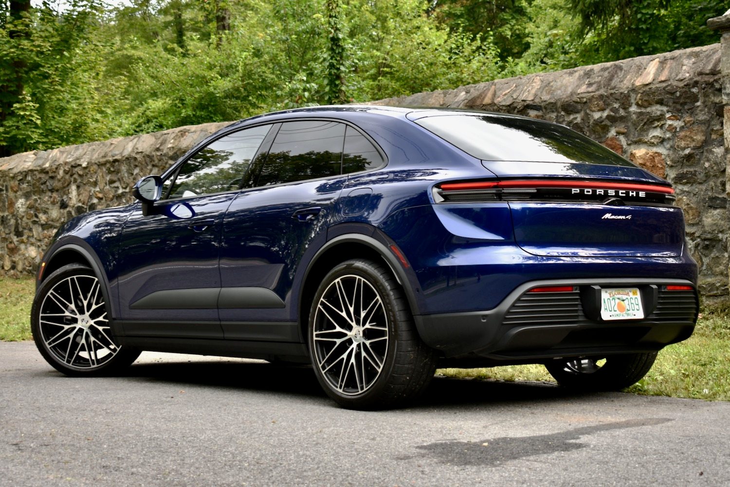 2025 Porsche Macan Electric rear quarter view.