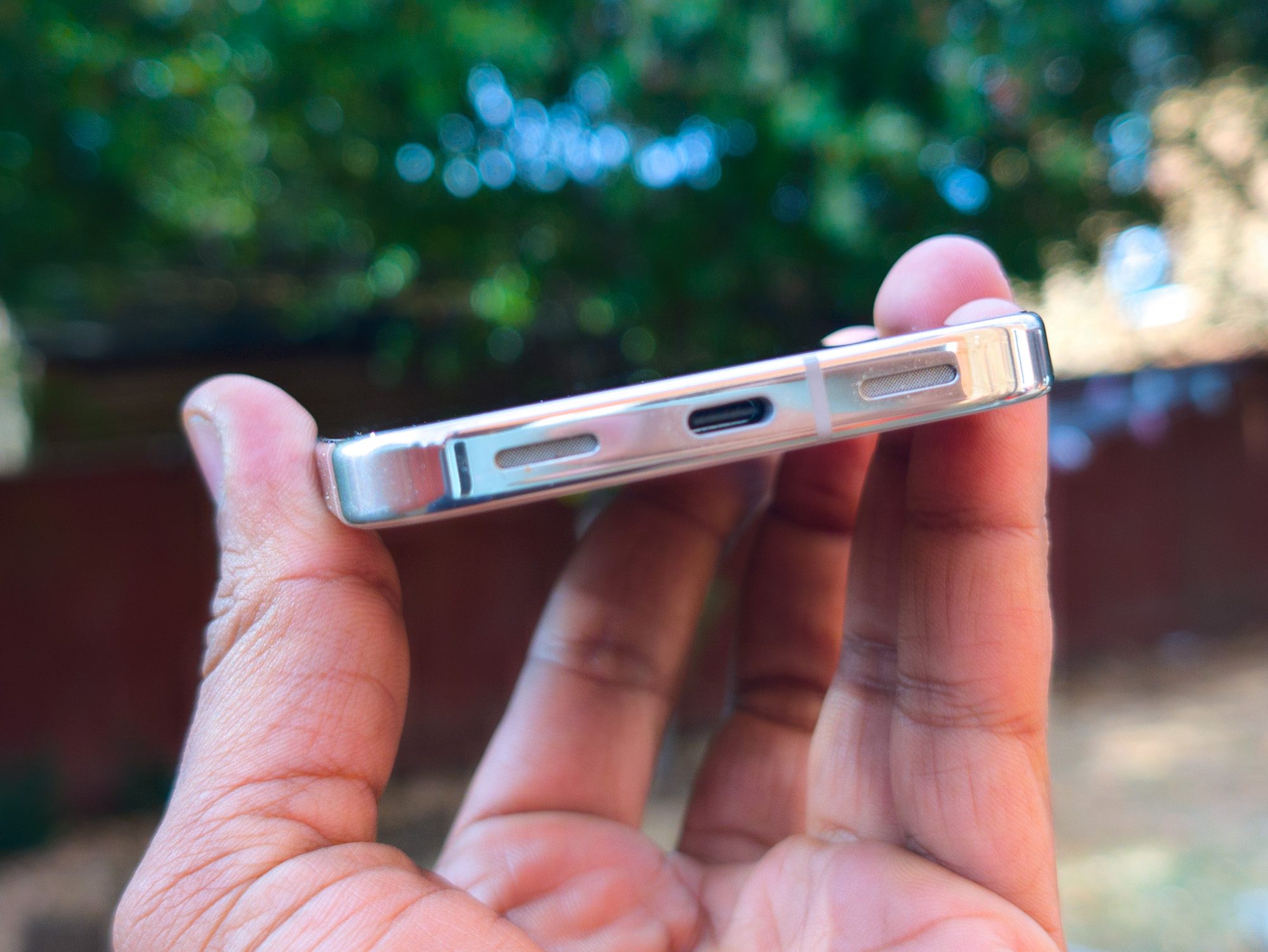USB-C port on the Google Pixel 10 Pro in Porcelain in the hand