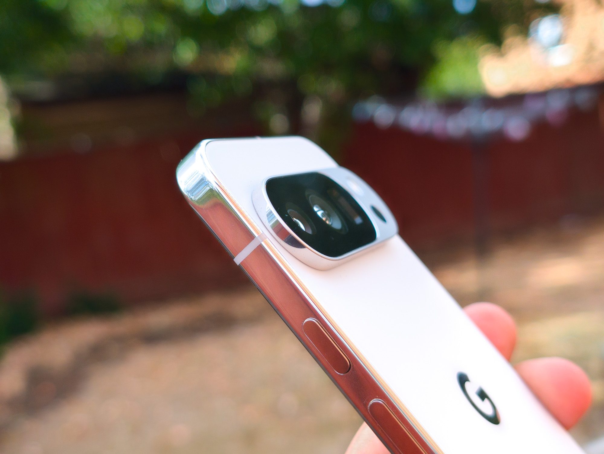Side profile of the camera bump on the Google Pixel 10 Pro in Porcelain in the hand