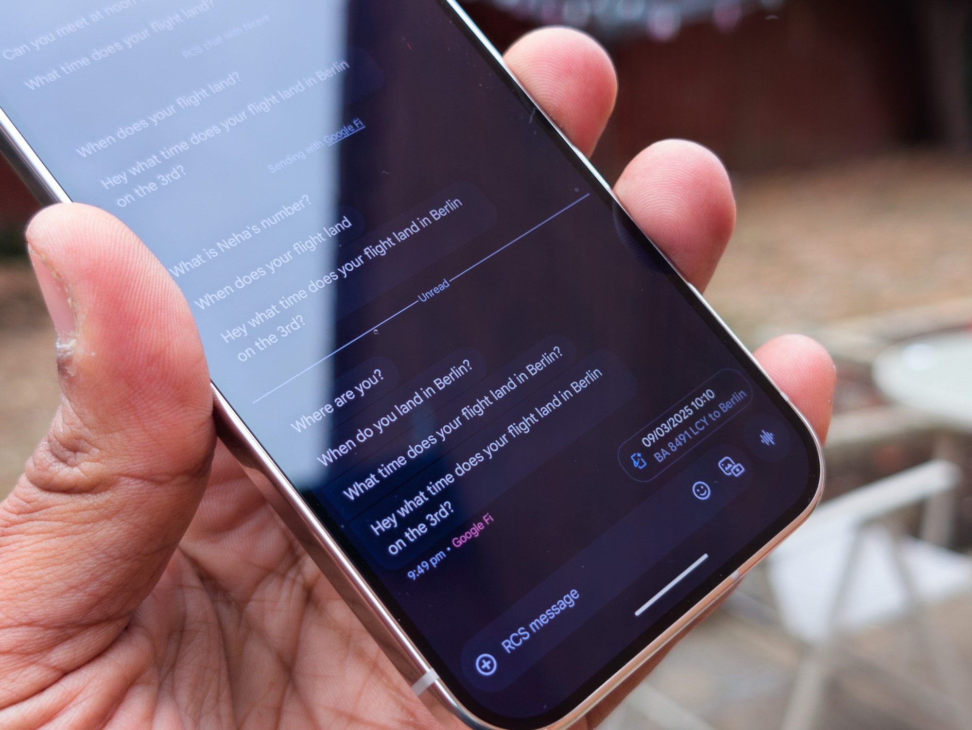 Flights suggested reply in Magic Cue on the Google Pixel 10 Pro in Porcelain in the hand