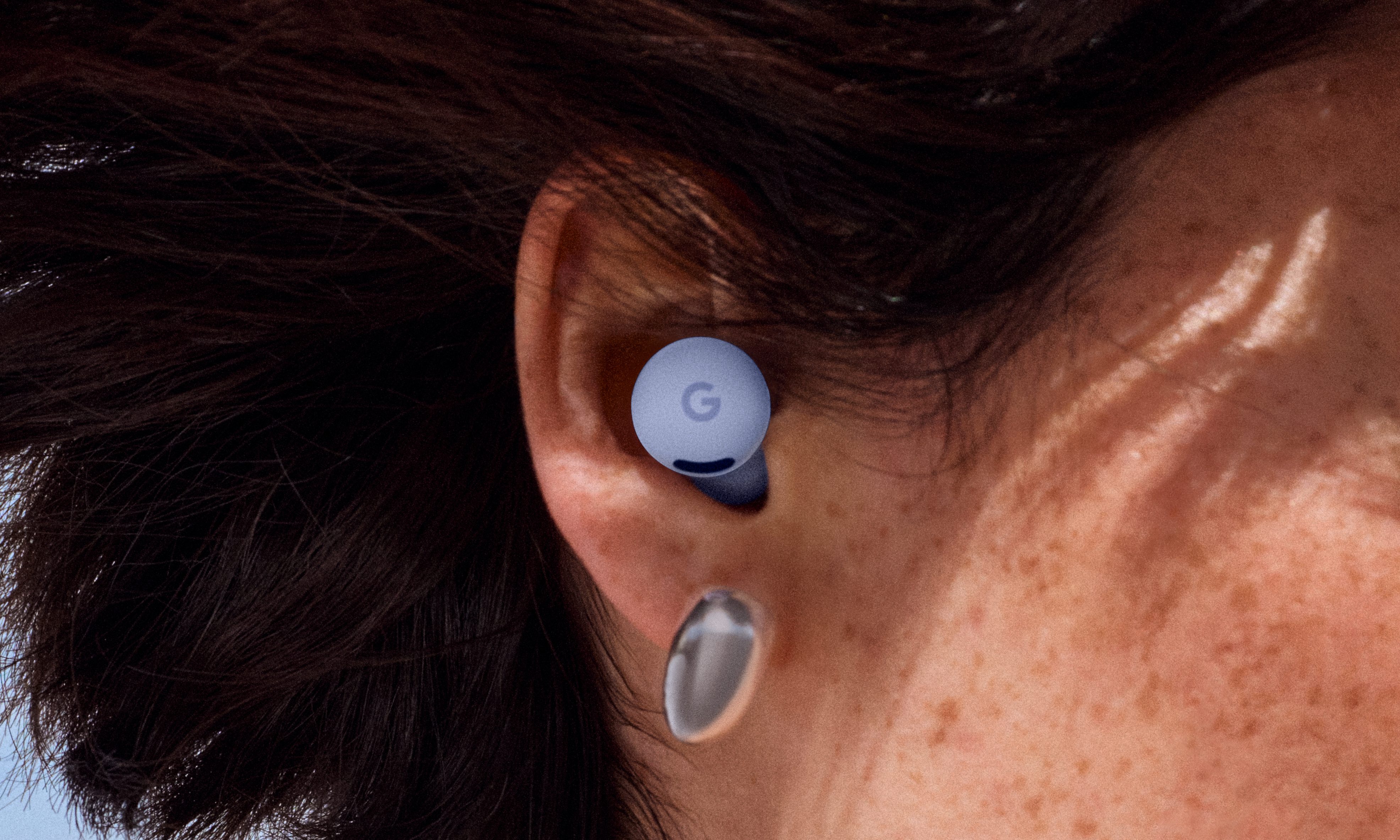 Google Pixel Buds 2a in the ear of a person