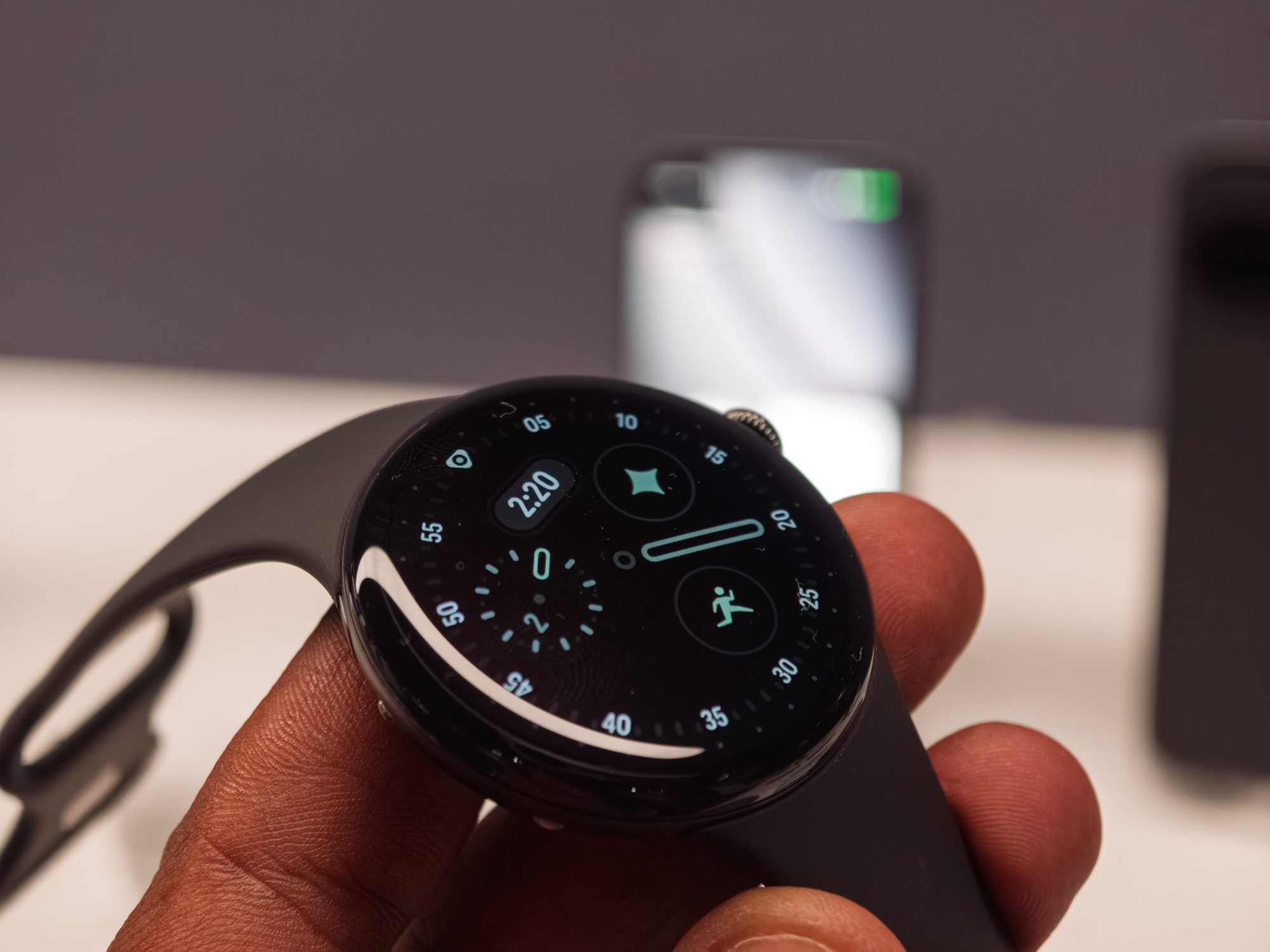 Google Pixel Watch 4 in black in the hand