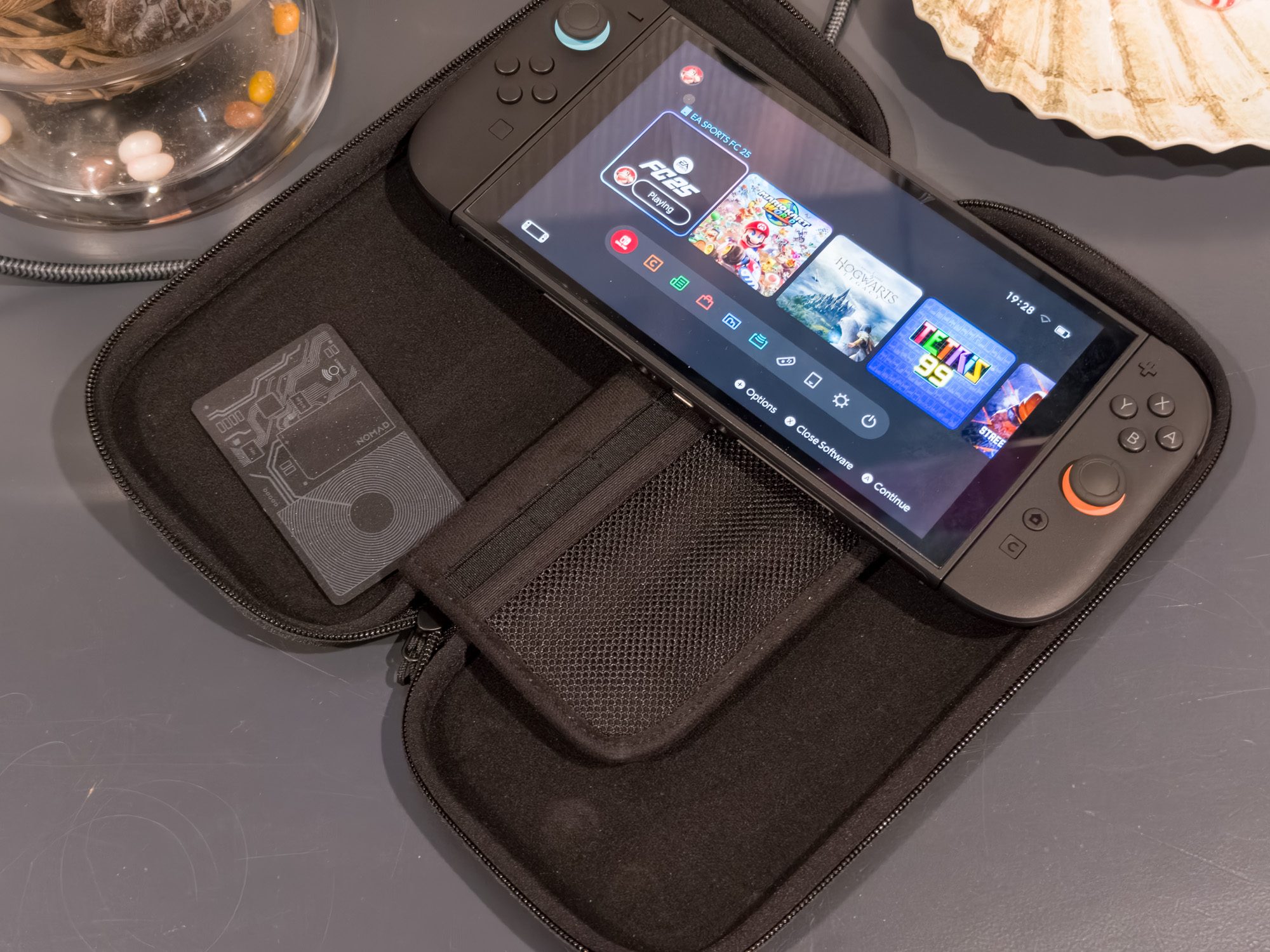 The official Nintendo Switch 2 All-in-One Carry Case and the Nomad Tracking Card