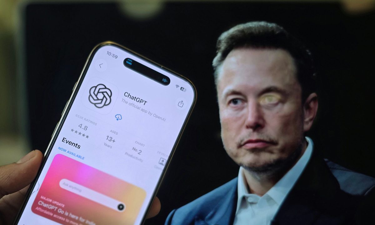 ChatGPT on a phone against the backdrop of Elon Musk.