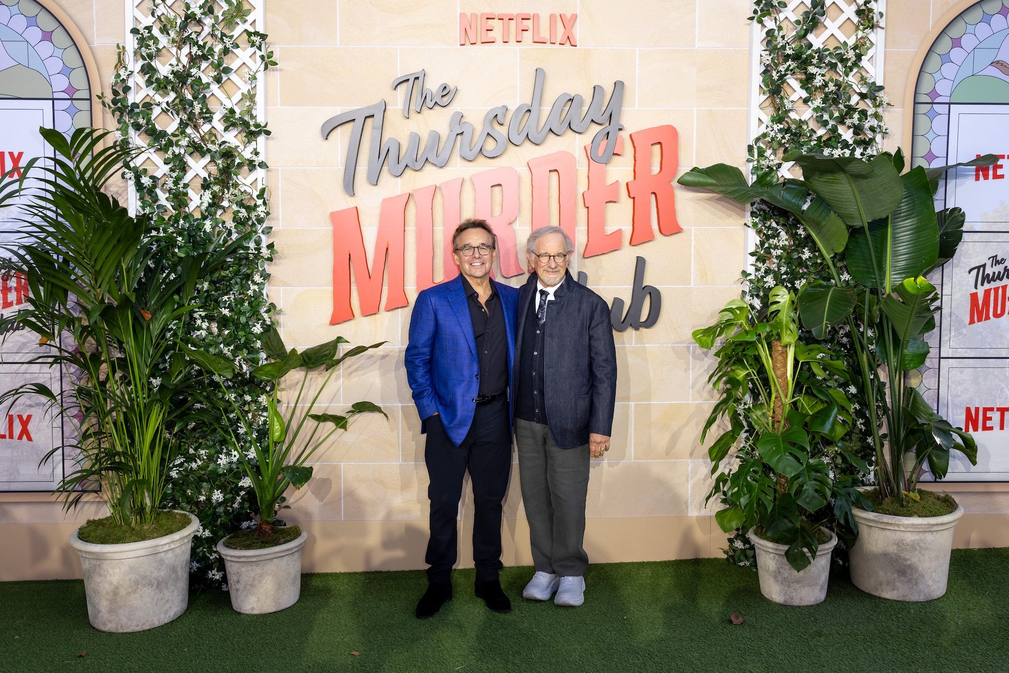 Chris Columbus and Steven Spielberg pose together on the red carpet.