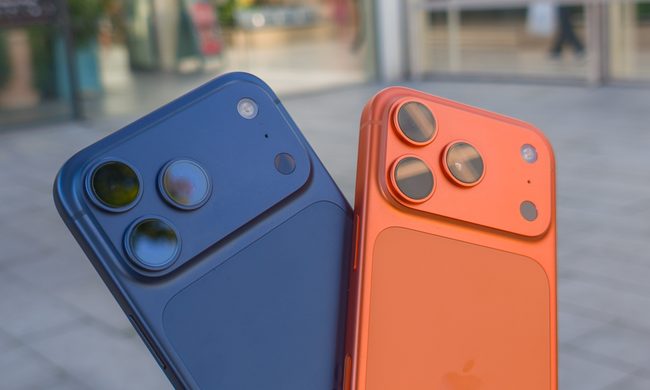Apple iPhone 17 Pro in Cosmic Orange next to the iPhone 17 Pro Max in Deep Blue