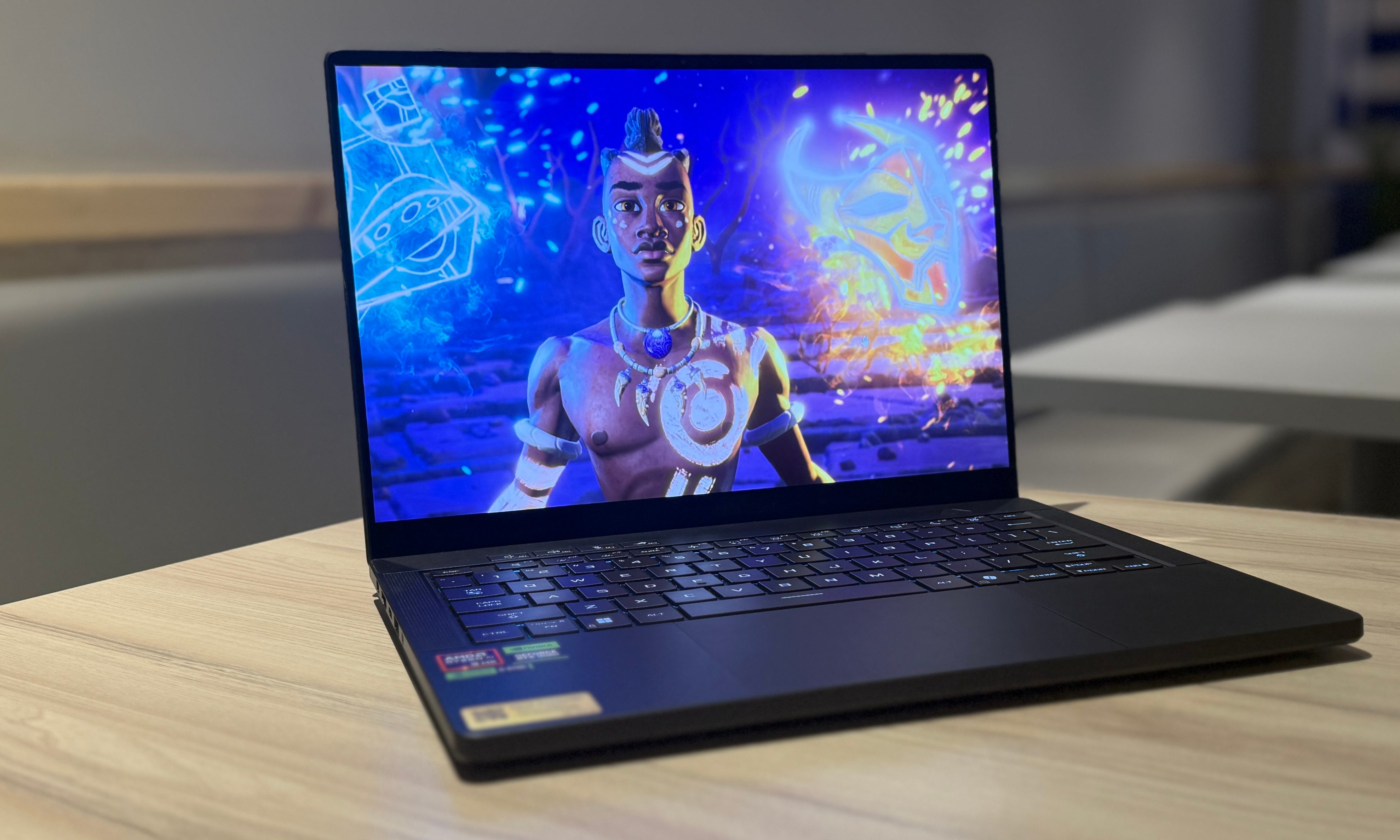 On the tabletop, there's an Asus ROG Zephyrus G14 laptop