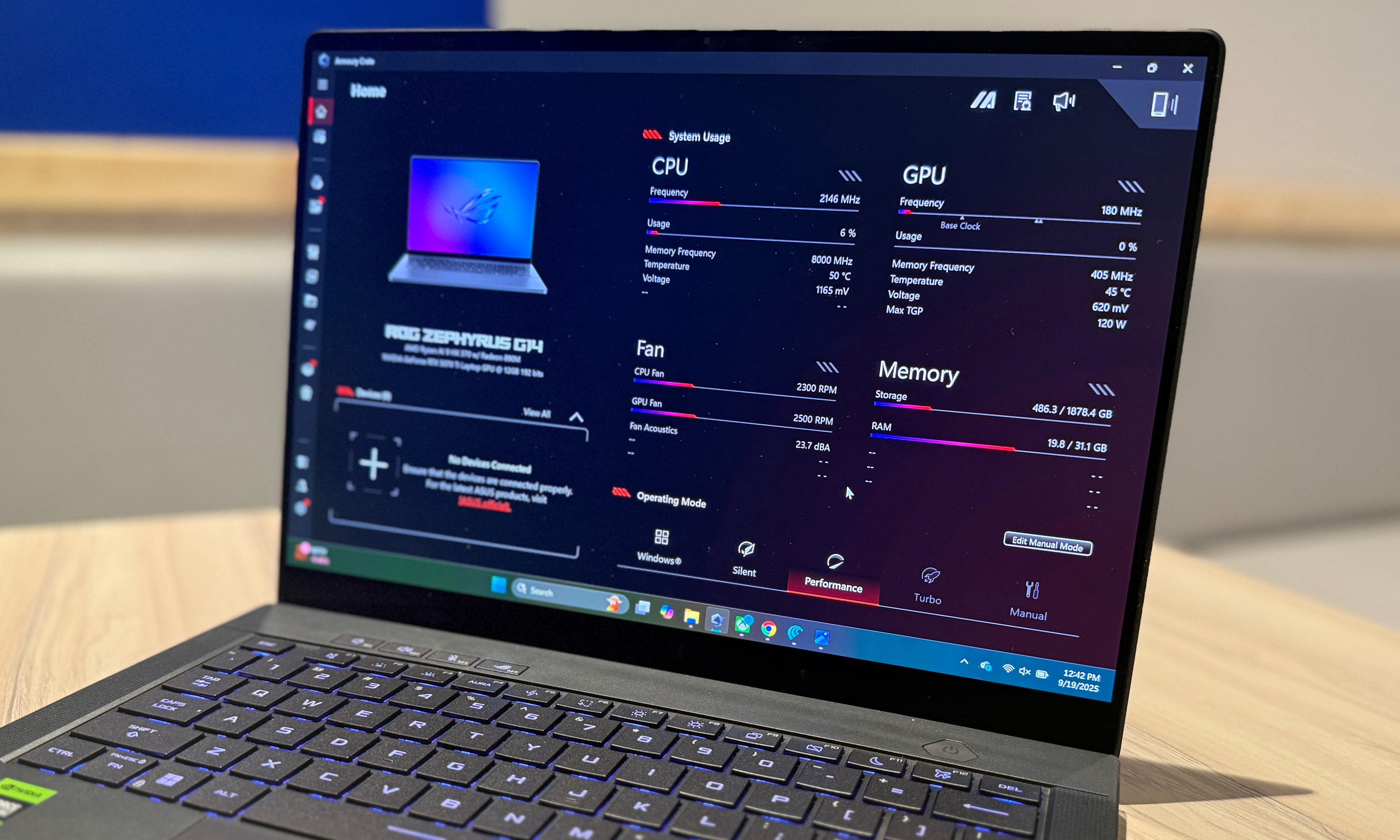Placed on a table is the Asus ROG Zephyrus G14 laptop.