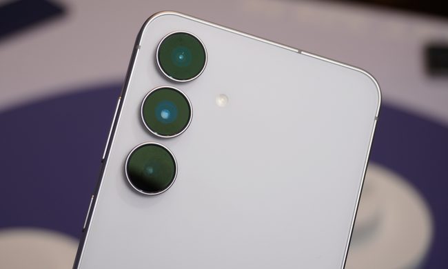 Close-up of three circular cameras on the back of the white Galaxy S25 FE