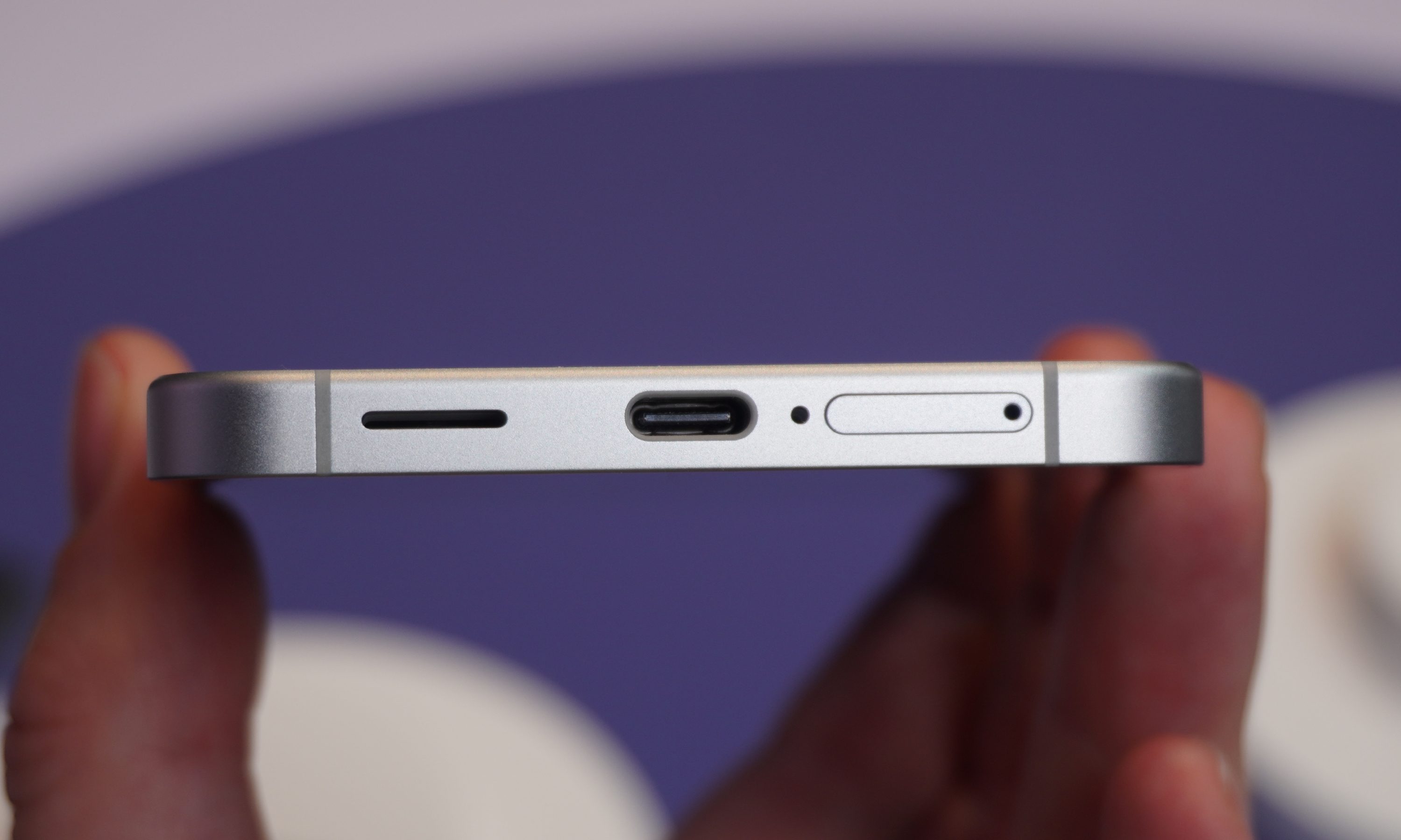 The bottom edge of the Galaxy S25 FE, with a USB-C port, speaker and SIM tray shown