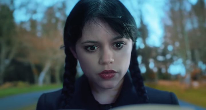 Jenna Ortega reading a journal in Wednesday season 2.