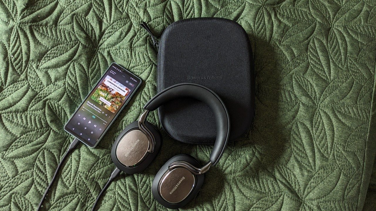 B&W Px8 S2 headphones and case next to a phone