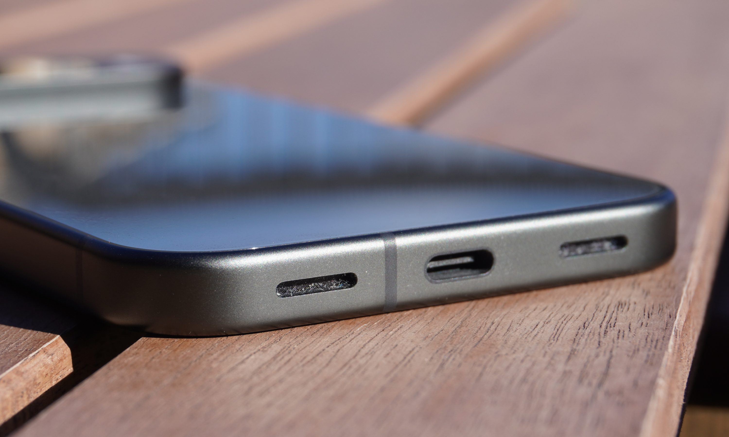 Base of Pixel 10 showing central USB-C port, flanked by two speakers