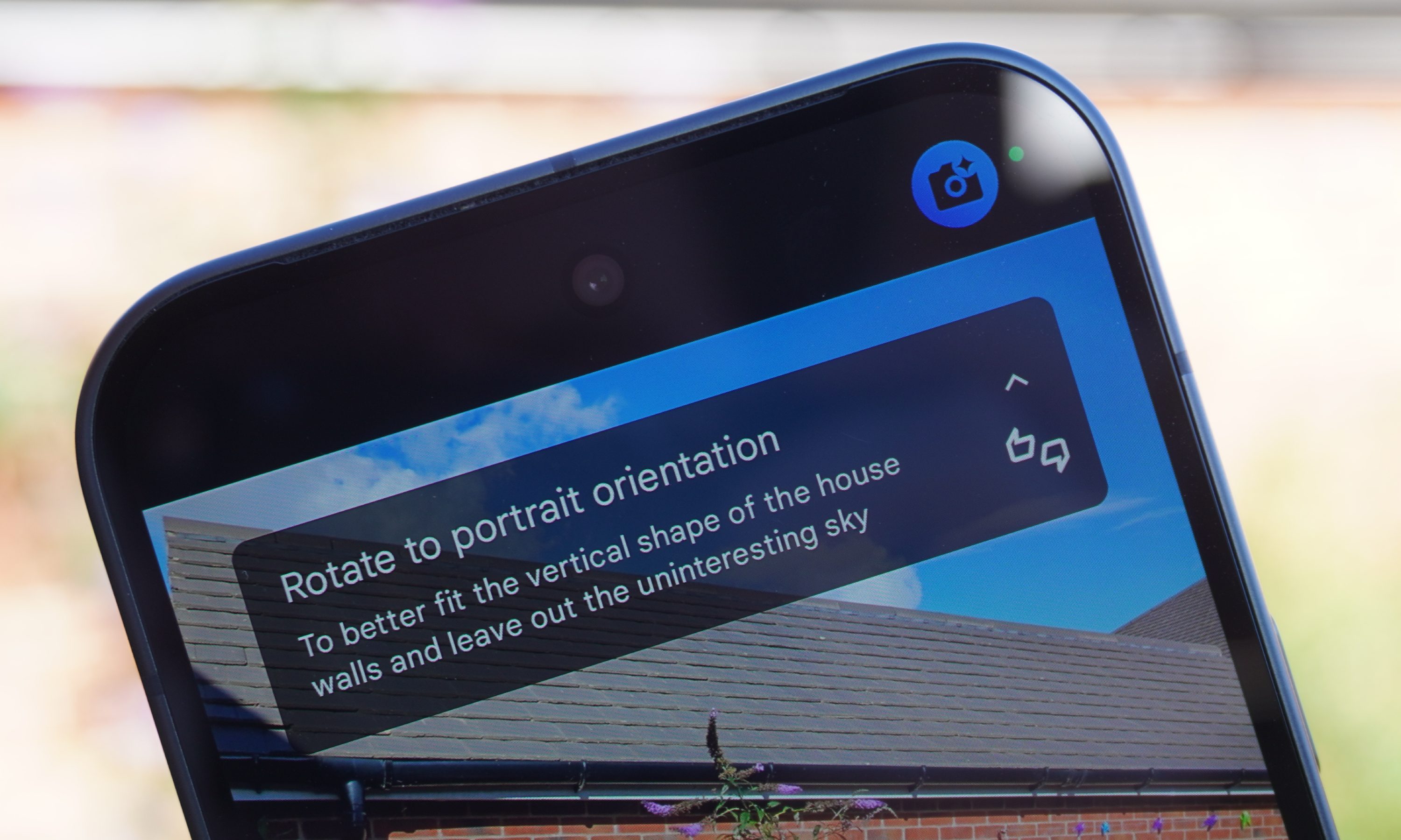 Camera coach on the Pixel 10 instructing user to rotate to portrait orientation