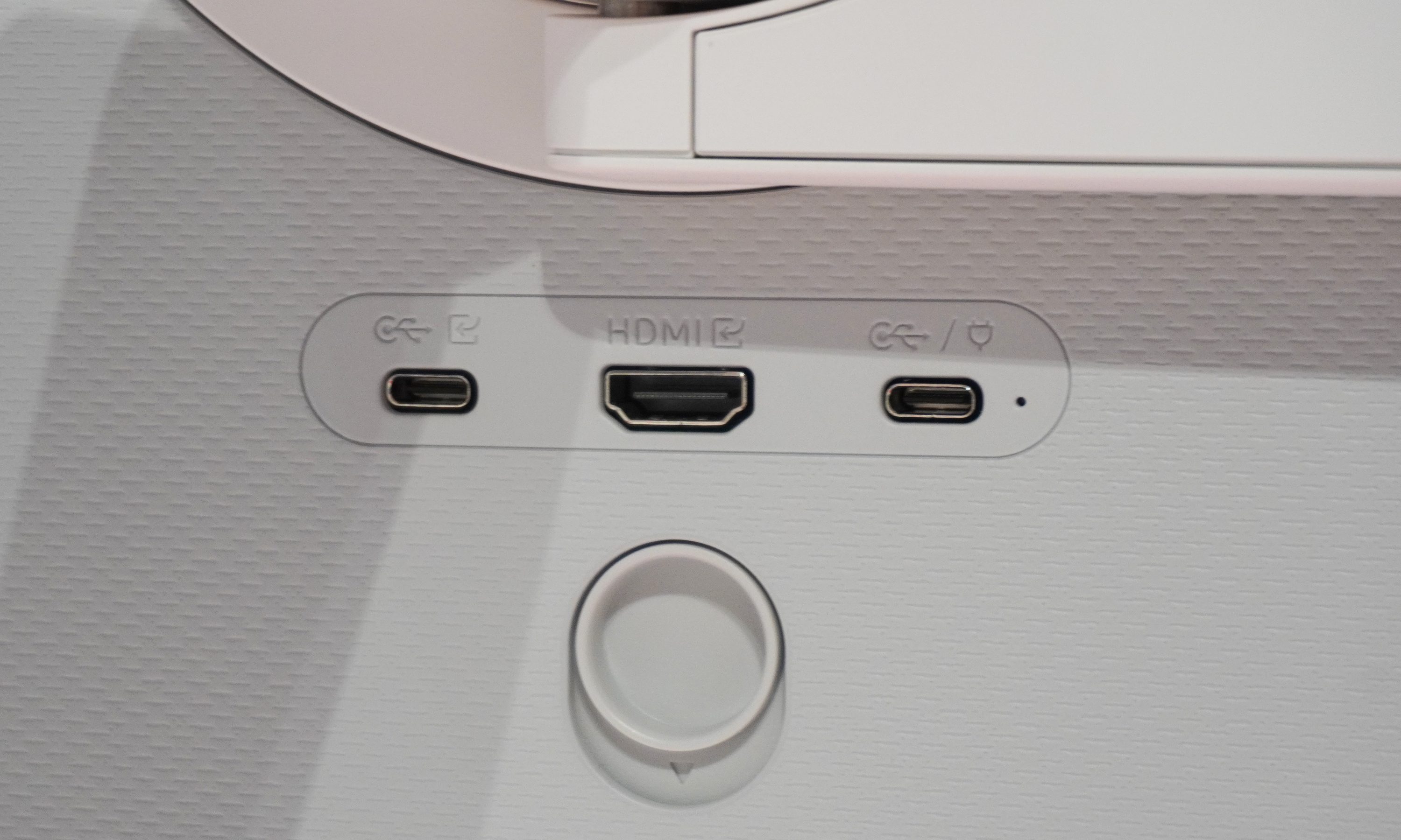 Close-up of three ports, two USB C and one HDMI, on the rear of the Movingstyle TV
