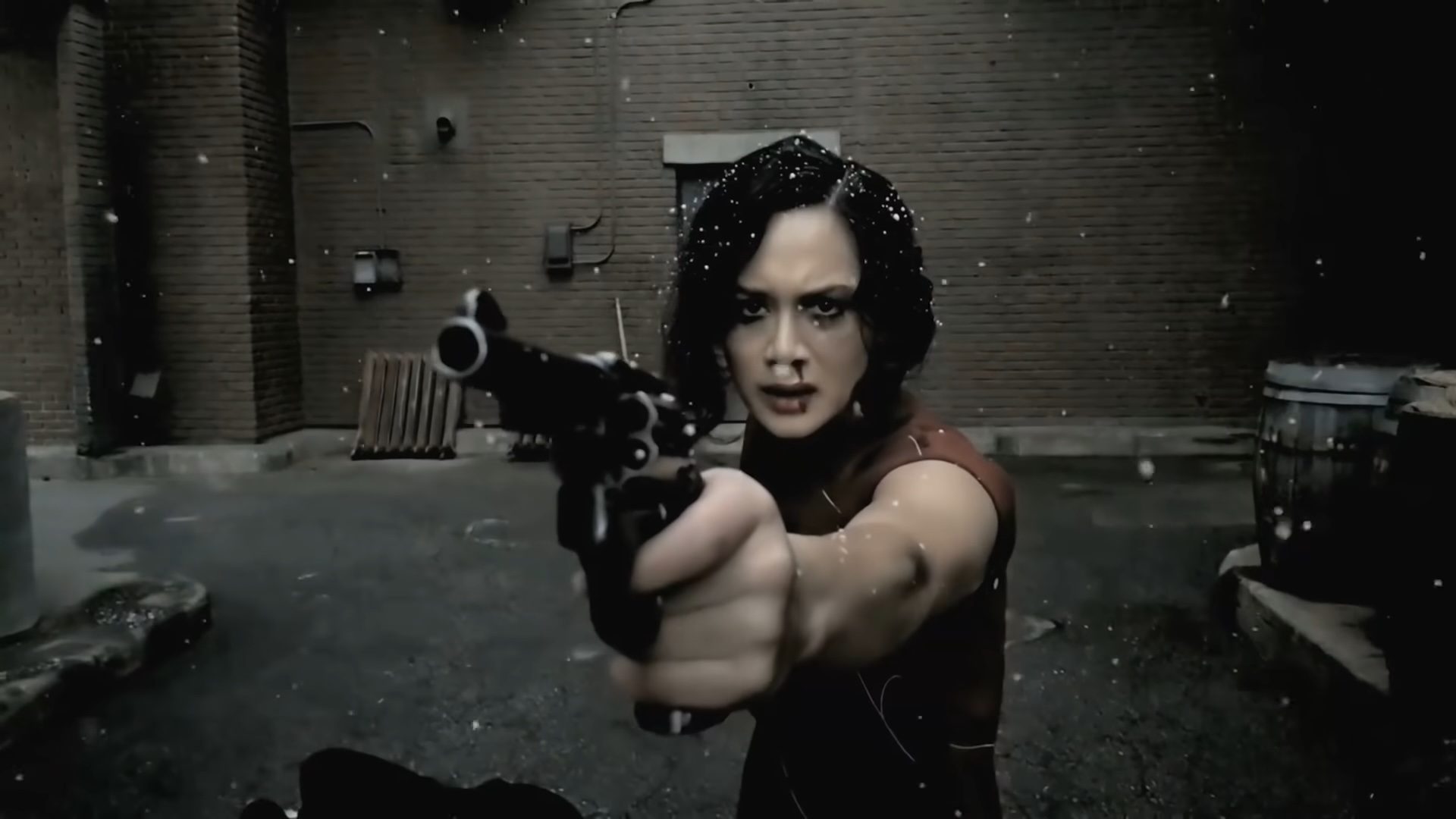A woman pointing a gun at the camera in Snow Steam Iron.
