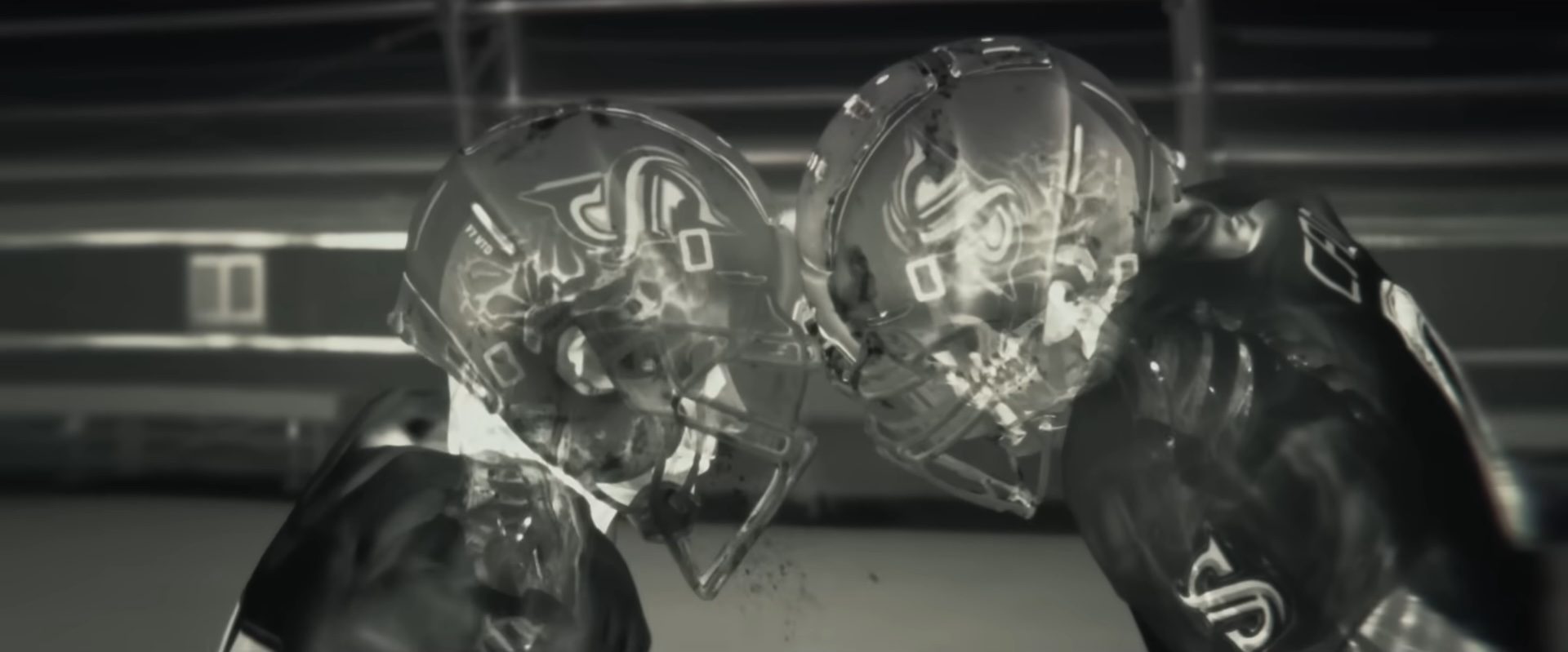 Two football players' heads colliding with each other in the film, Him.