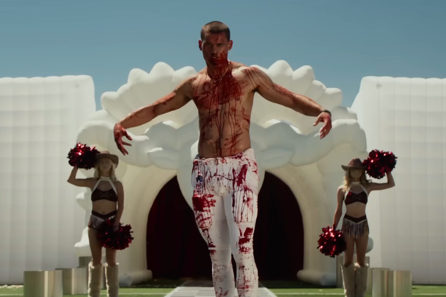 Tyriq Withers as a bloodied football player in the horror film, Him.