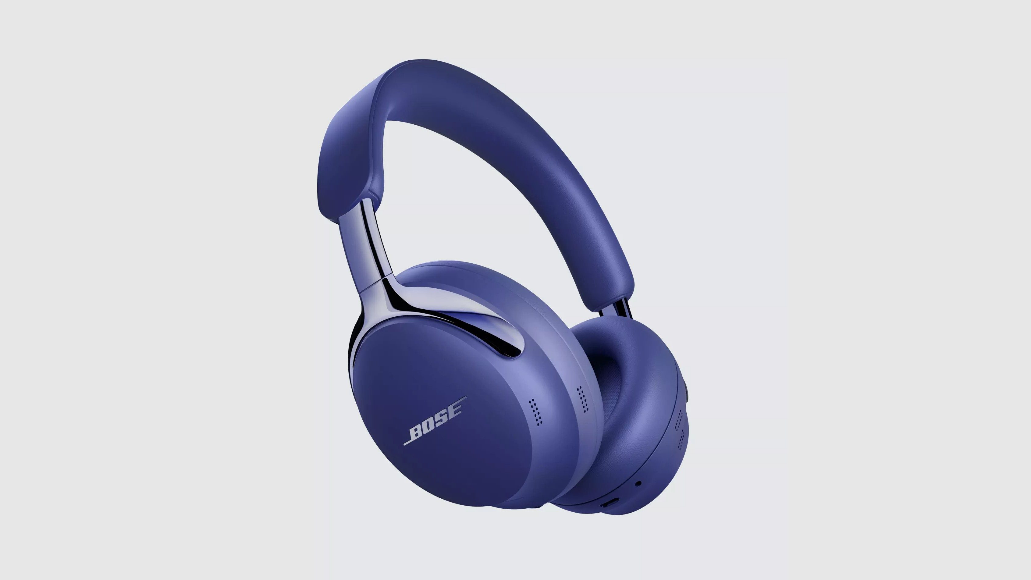 Purple Bose QuietComfort Ultra Headphones (2nd Gen) on a grey background