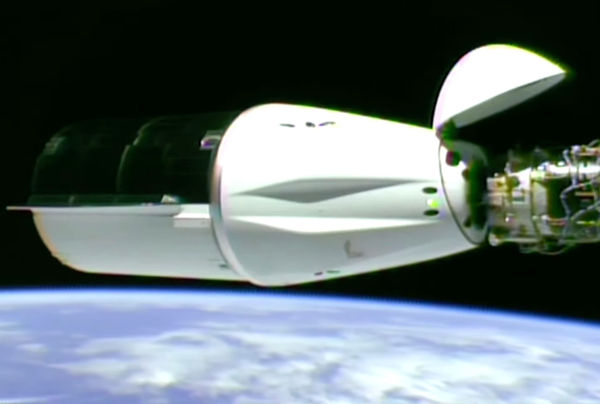 A SpaceX Dragon cargo ship shortly after docking at the ISS in August 2025.